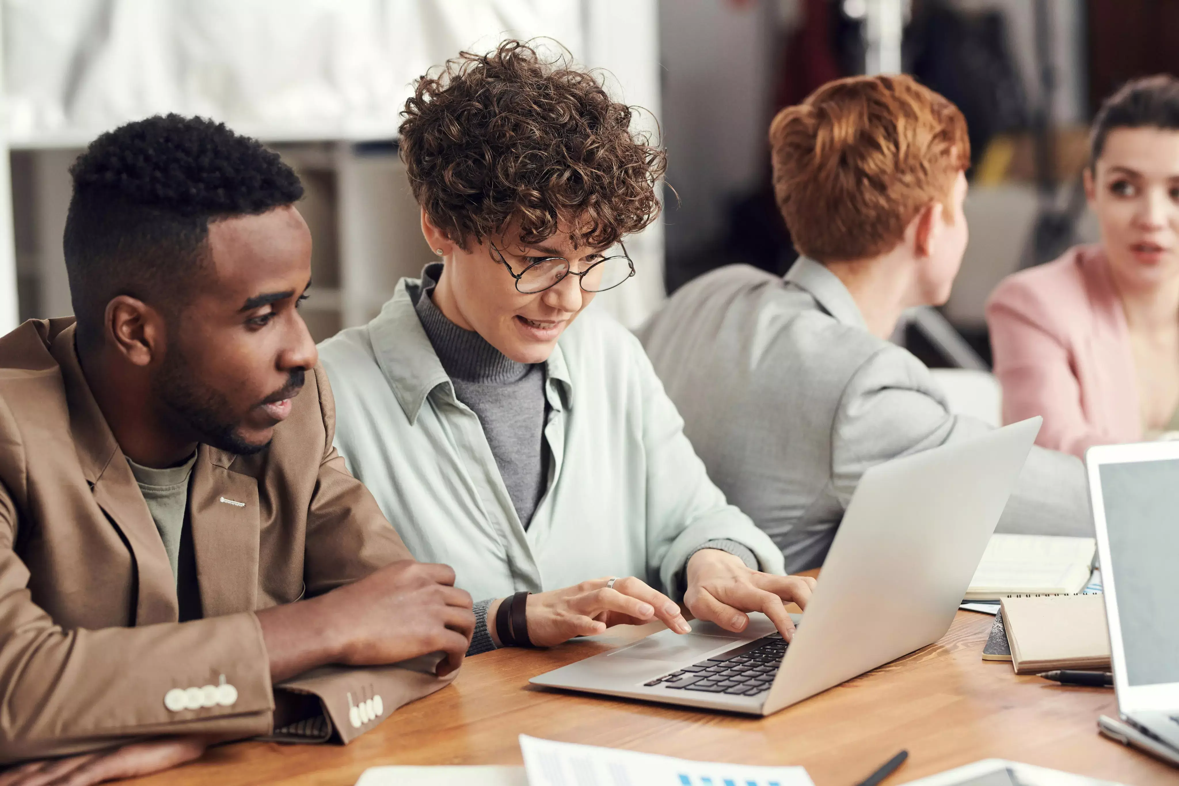 A group of people looking at a computer screen